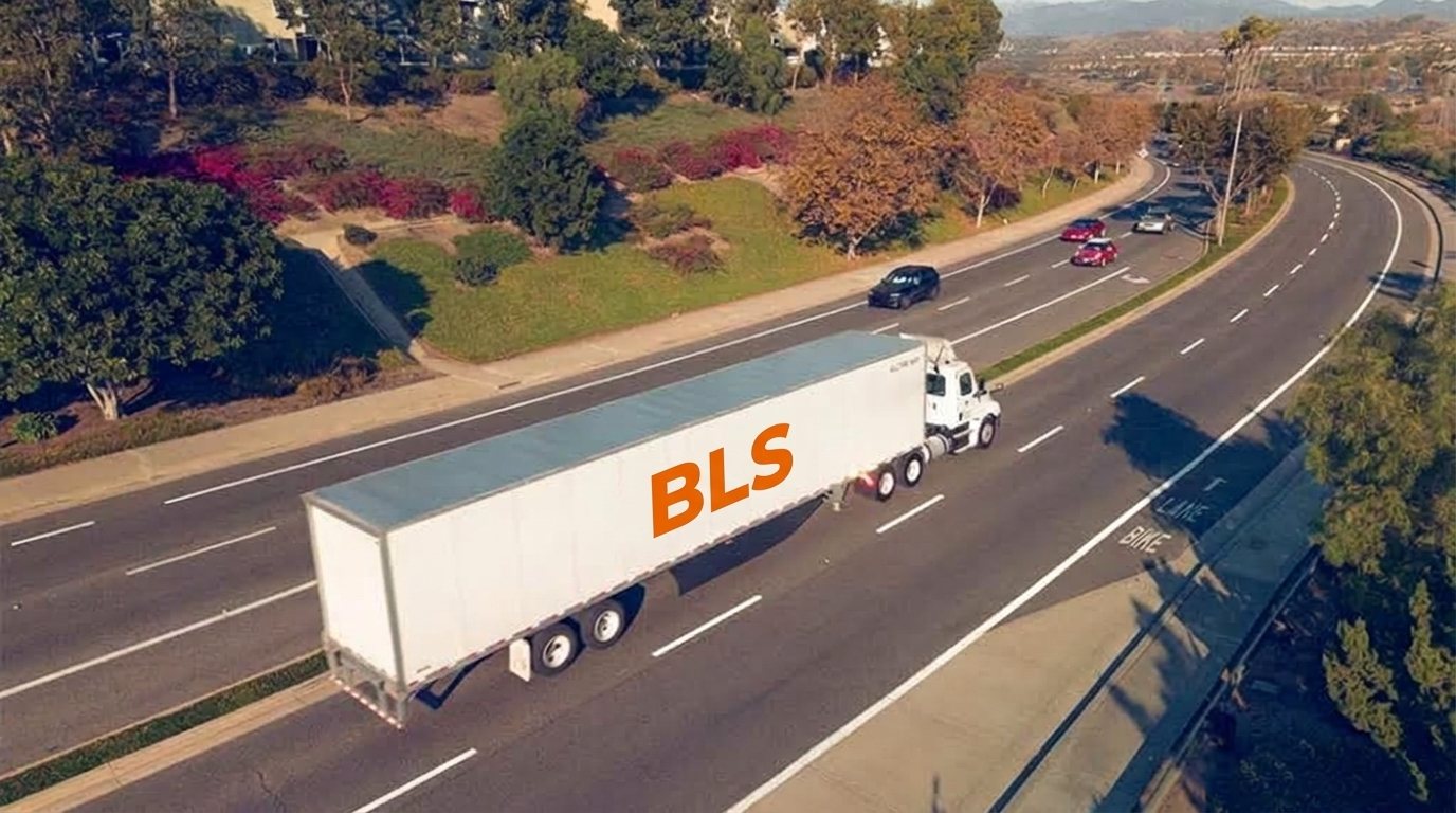 BLS branded truck driving on a highway